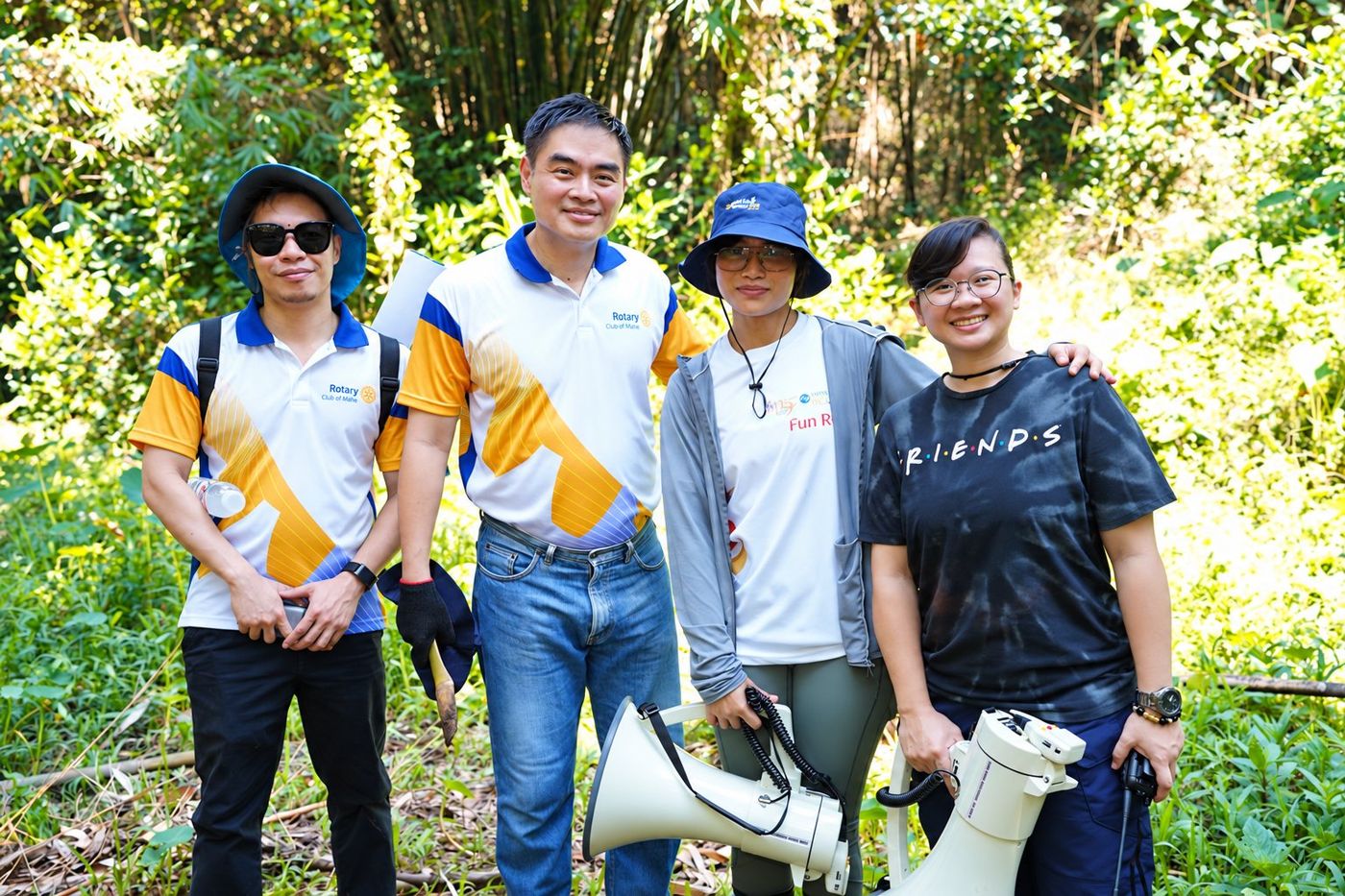 President Reggie Yu with STAR Rotarian Myles Tan, Ms. Jezreel Bean Pucio, Chief Administrative Officer and Environmental Committee Chairperson of the MWSS Regulatory Office, and her assistant, Michelle Bonoan, during the tree-planting activity at Ipo Dam.