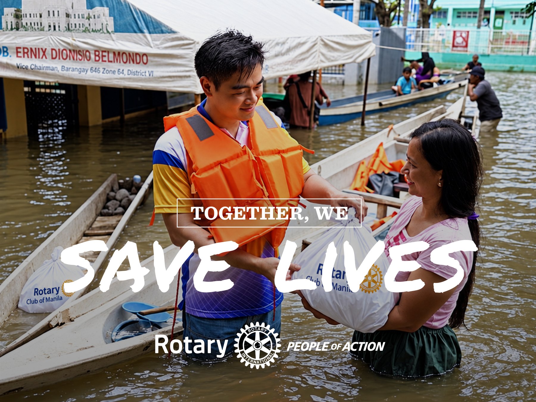 People of Action campaign artwork: a Rotarian in a life vest hands a Rotary Club of Manila relief bag to a woman standing in floodwater. Text: Together, we save lives. Rotary, People of Action.