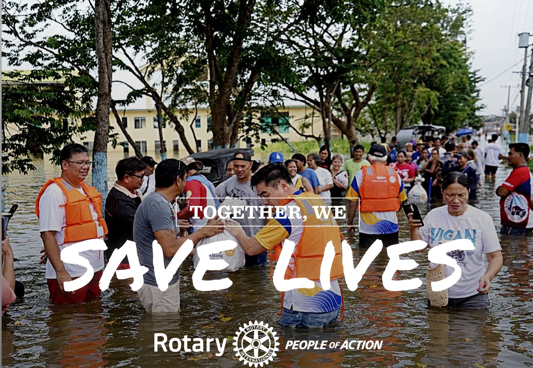 Rotarians in life vests wade waist-deep through floodwater carrying relief bags. Text: Together, we save lives. Rotary, People of Action.