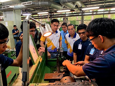 Members of the Rotary Club of Manila watch Dualtech scholars in hands-on precision machining training, September 2026.